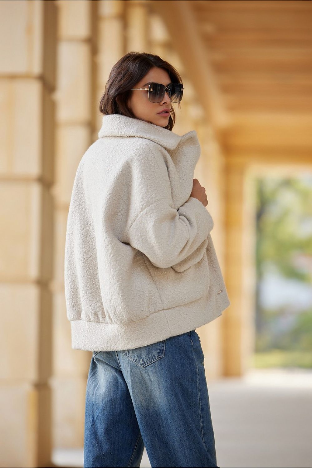 The Ivon Quilted Sheepskin Jacket by Roco Fashion, elegantly displayed, highlighting its classic button fastening and large functional pockets.