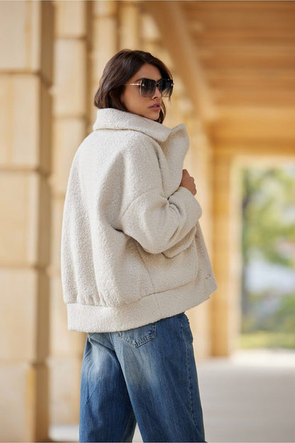 The Ivon Quilted Sheepskin Jacket by Roco Fashion, elegantly displayed, highlighting its classic button fastening and large functional pockets.