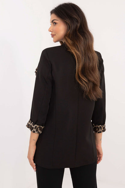 Detail shot of the striking fabric flower on the Italy Moda leopard pattern jacket, emphasizing unique style and elegance.