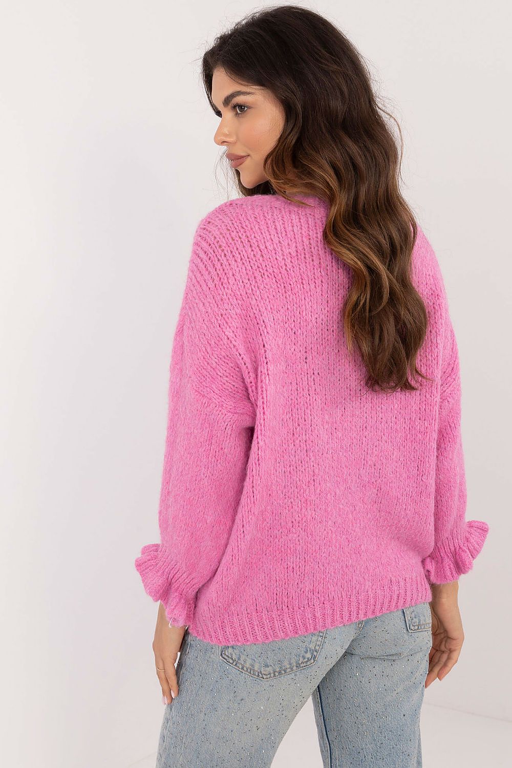 Chic Italy Moda women's sweater with a smooth pattern, offering a warm and comfortable fit for colder days, enhanced with fashionable ruffled sleeves.