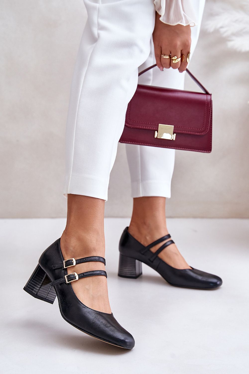 Elegant Laura Messi women's block heel pumps crafted from natural leather, featuring midfoot straps for added stability, perfect for sophisticated styling by Step in Style.