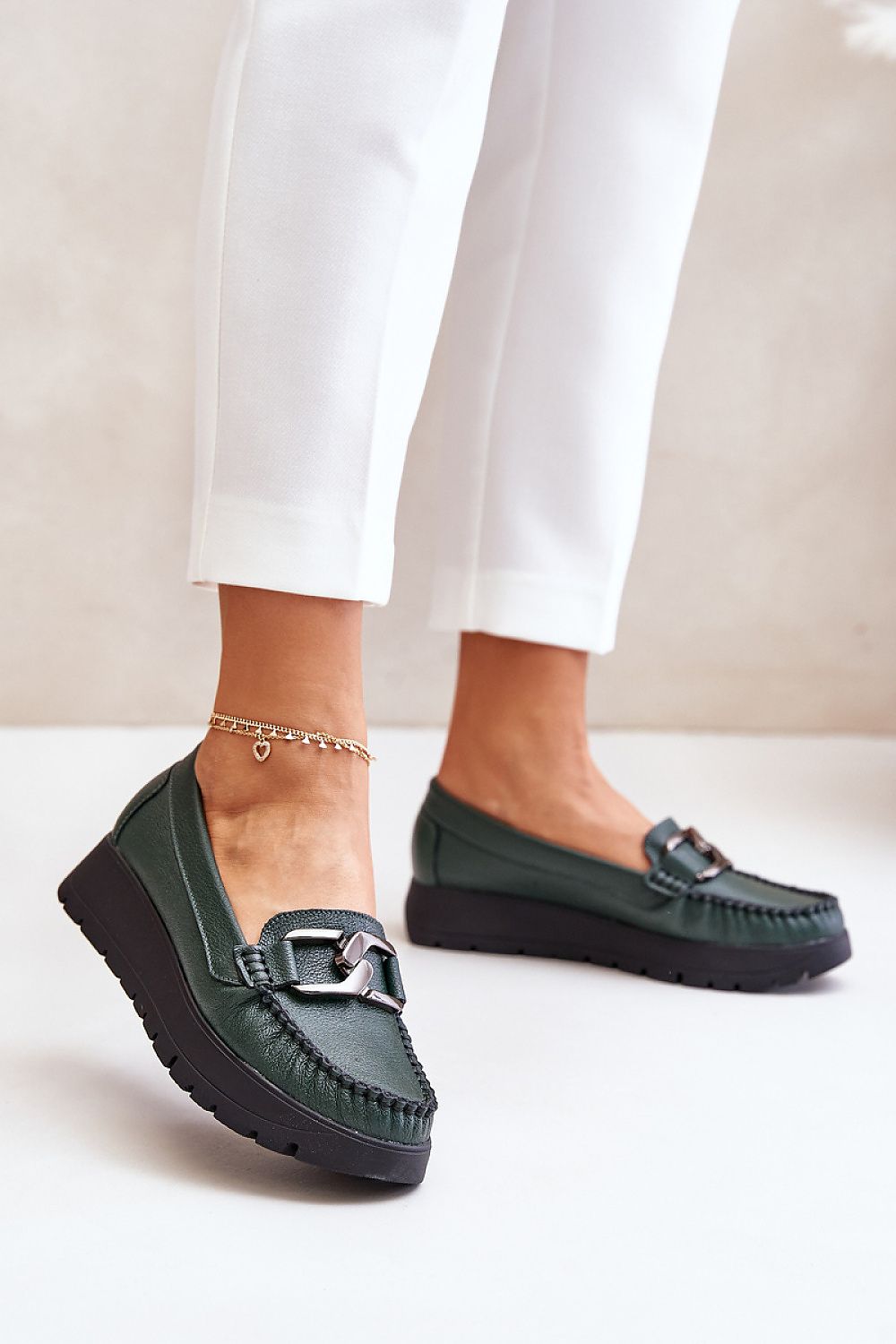 Elegant women's natural leather moccasins by Step in style featuring a stiffened heel counter and a decorative front design for luxurious comfort and stability.