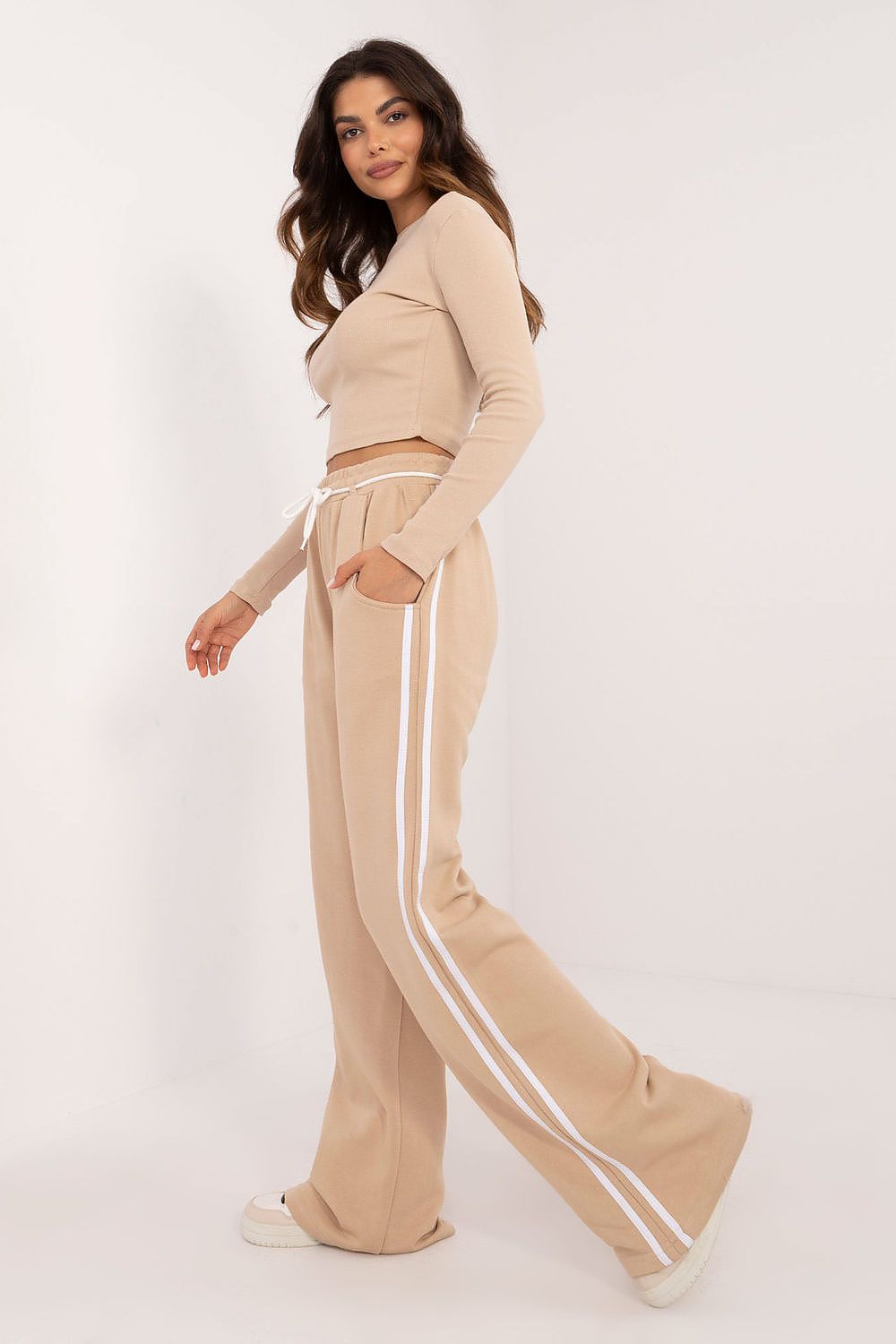 Sophisticated look of Factory Price's women's casual sporty set with ribbed blouse and wide leg high-waisted trousers, perfect for modern day wear.