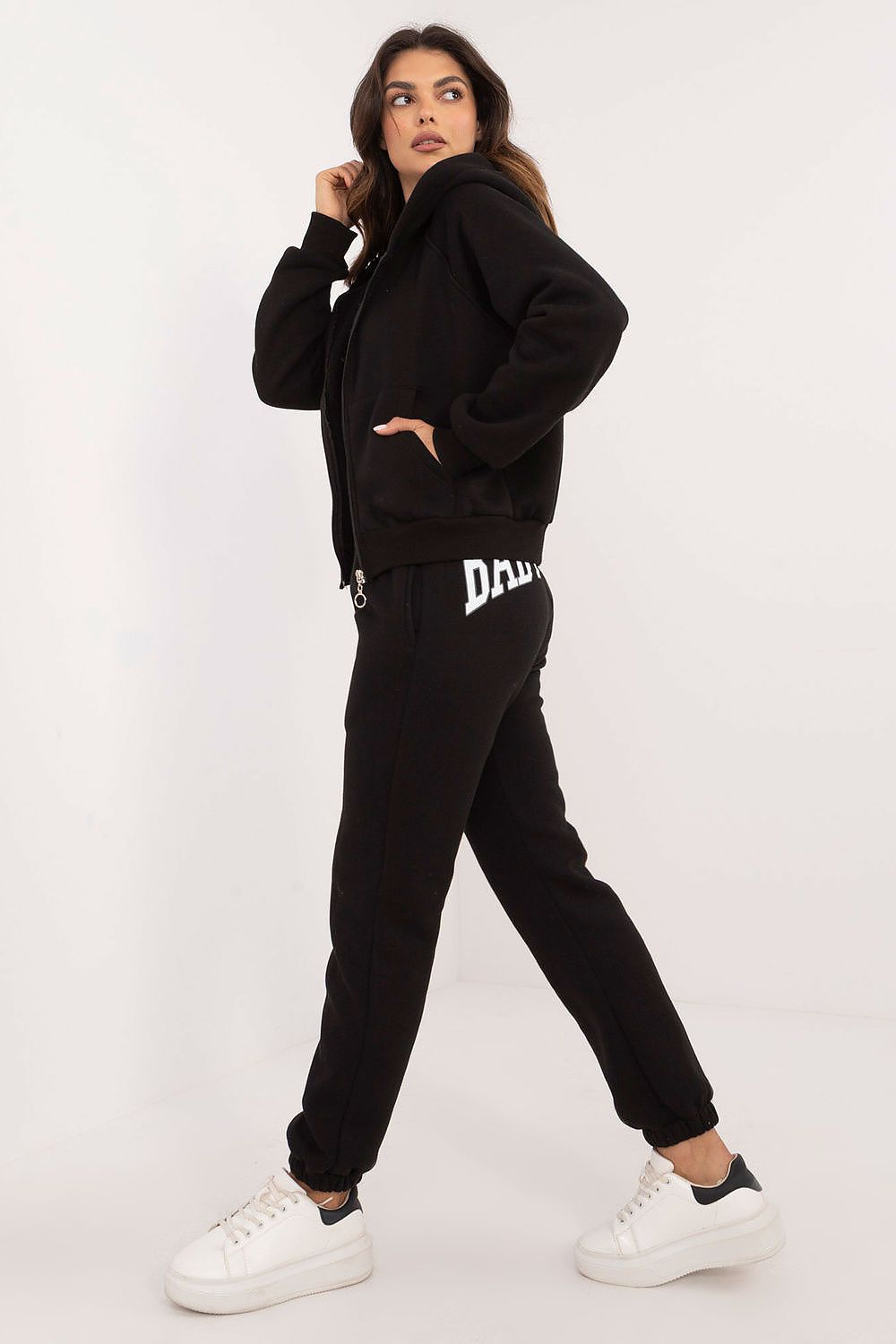 Chic high-rise trousers included in the Women's Casual Sporty Sweatshirt Set by Factory Price, designed with side slip pockets and a subtle print detail for a modern look.