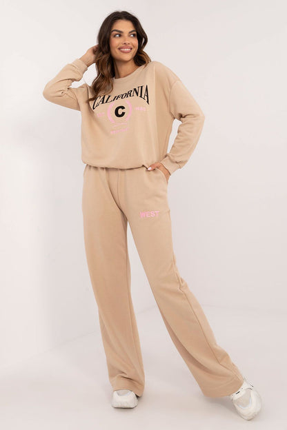Elegant women's casual cotton set from Factory Price featuring a long-sleeved blouse and high-waisted pants with original prints, highlighting luxurious comfort and modern style.