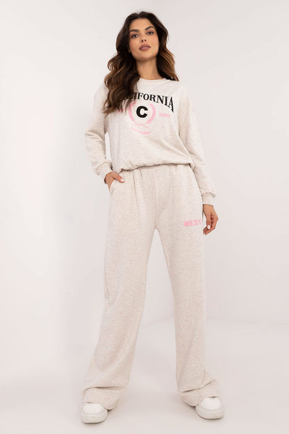 Model wearing Factory Price's elegant women's casual cotton set, highlighting the combination of long sleeves and high-waisted pants for a fashionable everyday outfit.