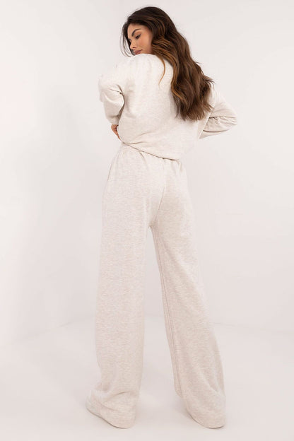 Elegant women's casual cotton set by Factory Price featuring long sleeves and high-waisted pants with original prints, perfect for a luxurious everyday look.