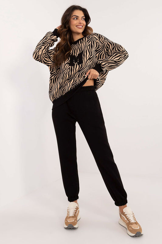 Elegant casual women's set featuring an animal print sweatshirt, long sleeve blouse, and high waist trousers by Factory Price.