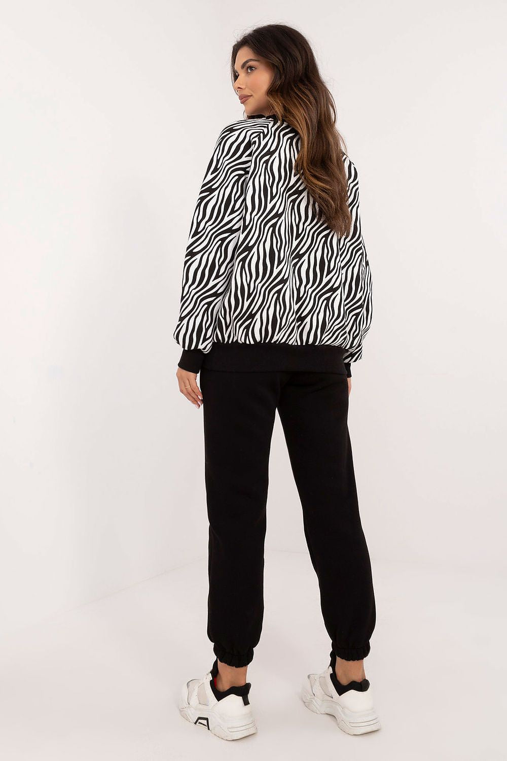 Chic long sleeve blouse with round neckline and decorative patch, part of the luxurious animal print casual women's set by Factory Price, embodying comfort and style.