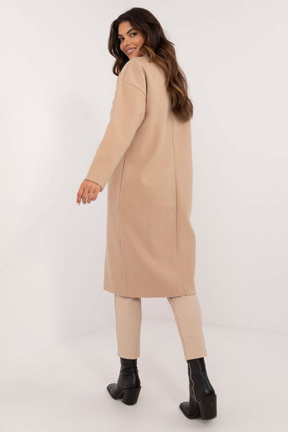 Elegant Och Bella women's over-the-knee coat in smooth black polyester, showcasing its sophisticated single-breasted style and high-quality finish.