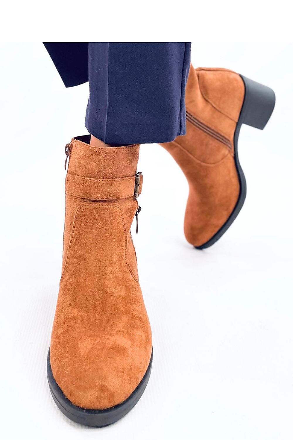 Inello women's eco-suede heel boots elegantly displayed, highlighting the soft fur lining and versatile design perfect for chic looks.