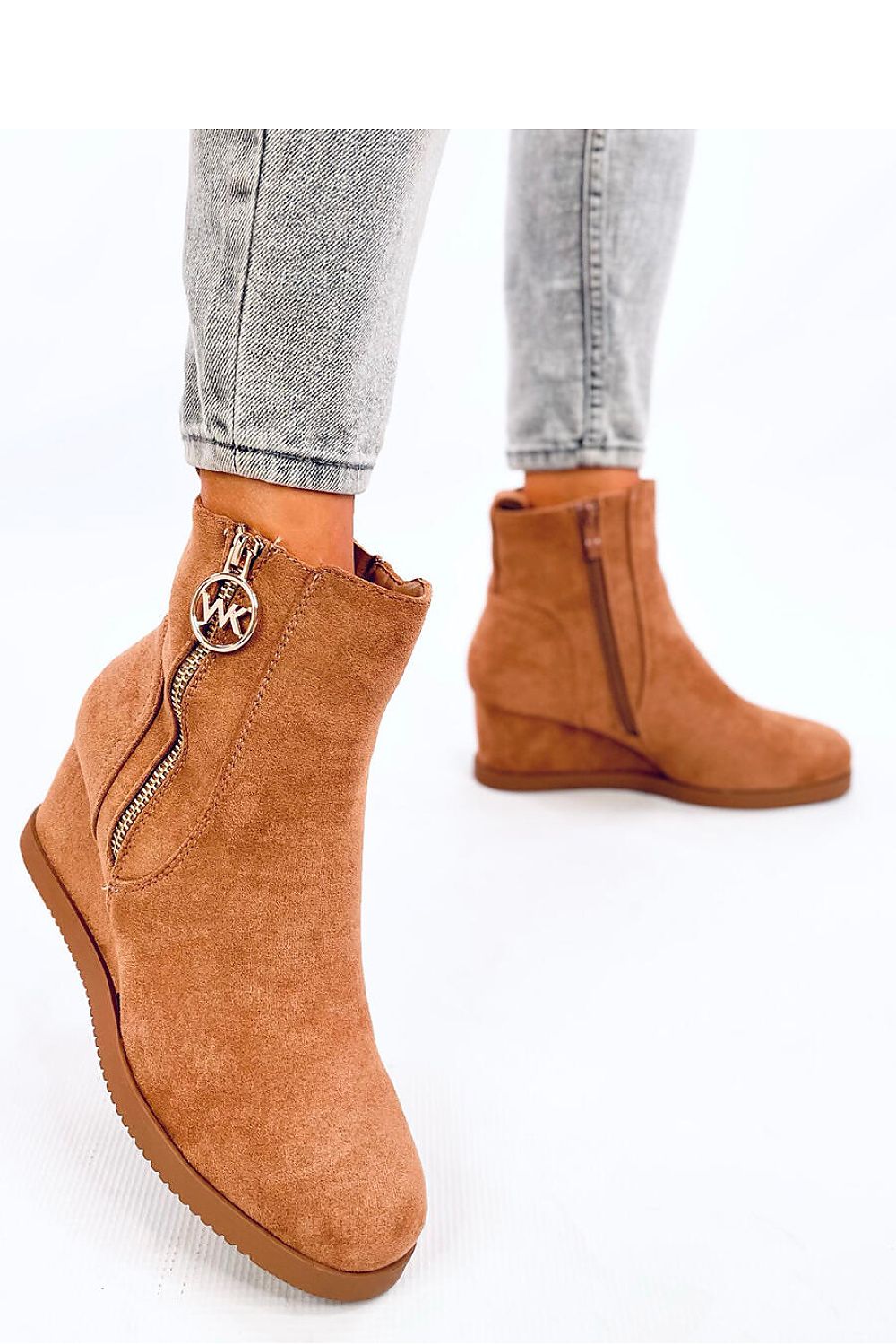 Elegant women's eco-suede buskin boots by Inello featuring a luxurious gold zipper, 6 cm heel, and soft fur lining, perfect for fashionable autumn and winter outings.
