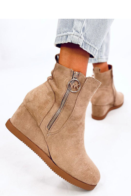 Elegant Inello eco-suede women's boots with warm fur lining and fashionable gold zipper, ideal for a sophisticated winter look.