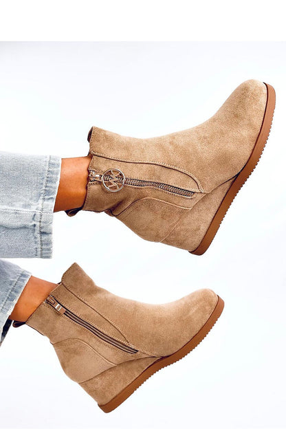Close-up of Inello Women's Eco-Suede Buskin Boots, showcasing the elegant gold zipper and soft fur lining, crafted for a sumptuous fit and sophisticated look.