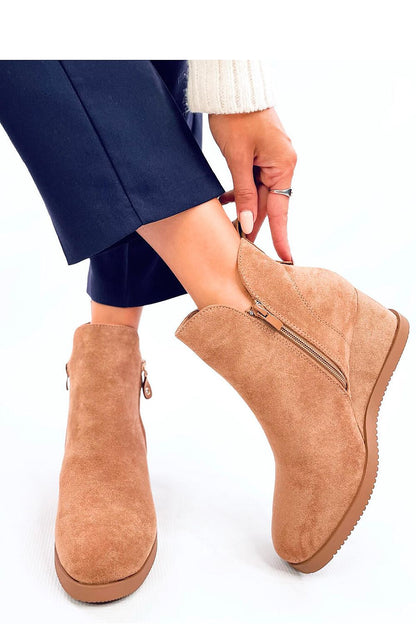 Close-up of Inello's luxurious eco-suede buskin boots, showcasing the decorative zipper and subtle cutout details.