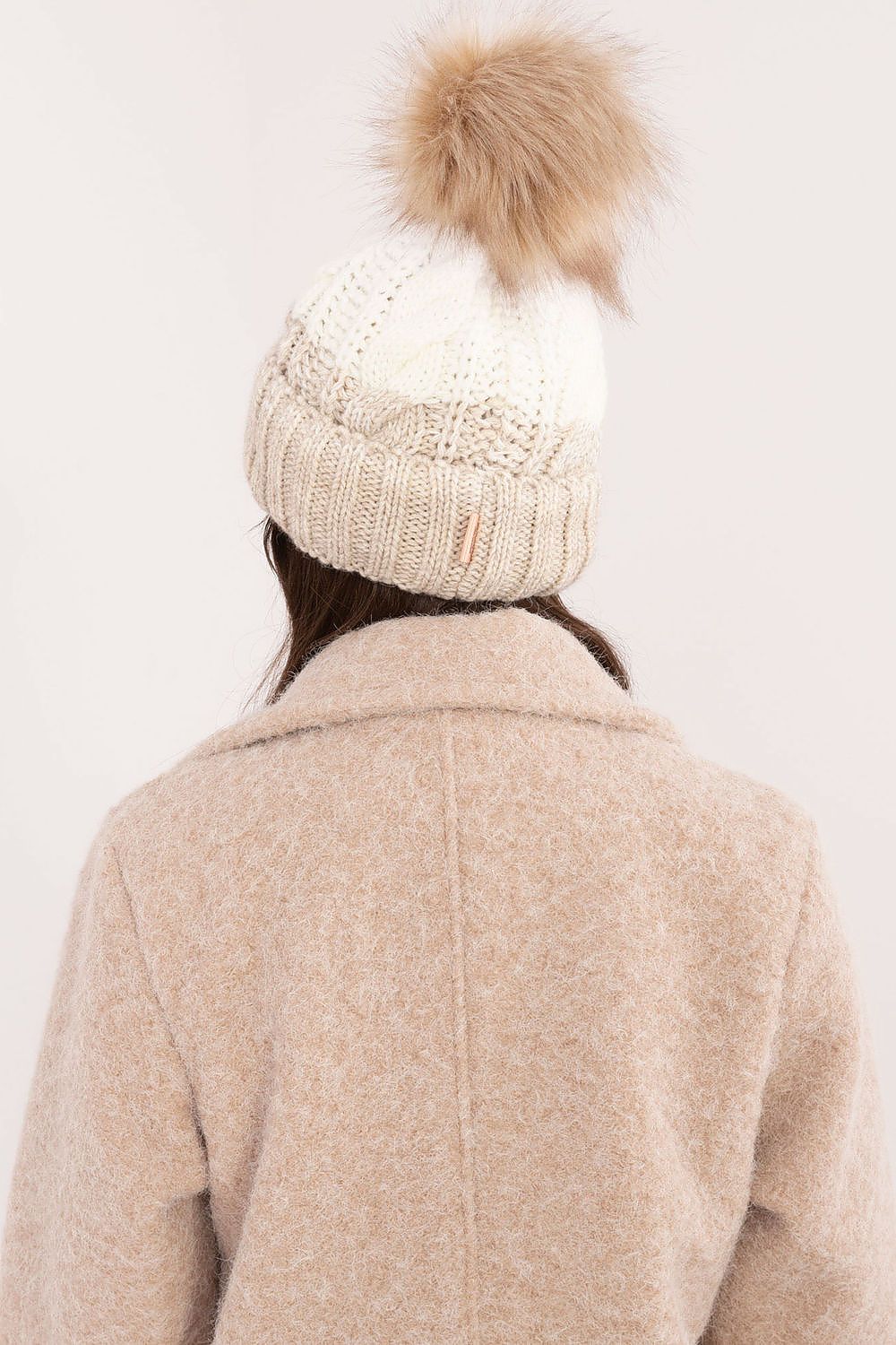 Close-up of Rue Paris winter beanie showcasing the soft acrylic, polyamide, and wool blend fabric, ideal for warmth and comfort during cold days.