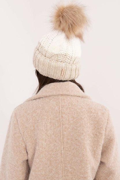 Close-up of Rue Paris winter beanie showcasing the soft acrylic, polyamide, and wool blend fabric, ideal for warmth and comfort during cold days.