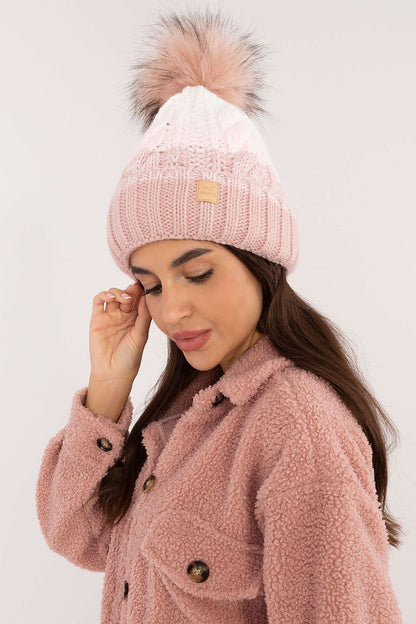 Luxury acrylic and polyamide winter beanie with a fluffy pom-pom, designed by Rue Paris to elevate your winter style.