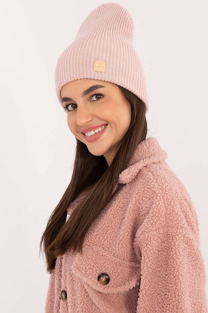 Model wearing the Classic Acrylic Beanie Hat by Rue Paris, demonstrating its versatility and fashionable appeal in a casual outdoor setting.