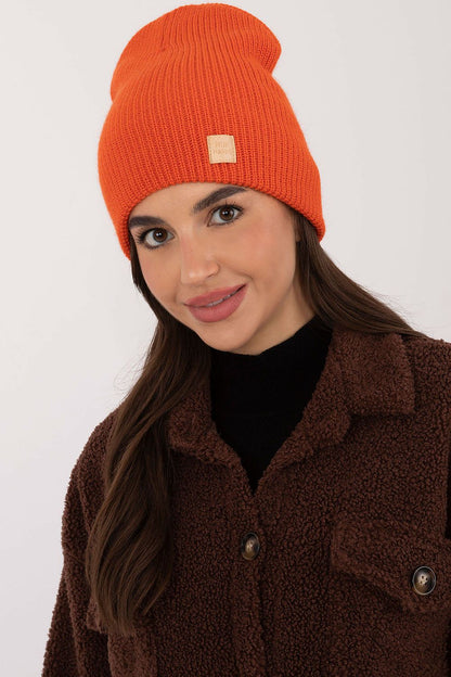 Chic Classic Acrylic Beanie by Rue Paris in a smooth monochromatic style, ideal for enhancing everyday luxury outfits.