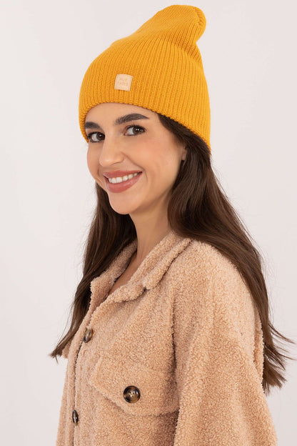 Timeless Classic Acrylic Beanie Hat by Rue Paris, features a discreet patch for an added touch of sophistication.
