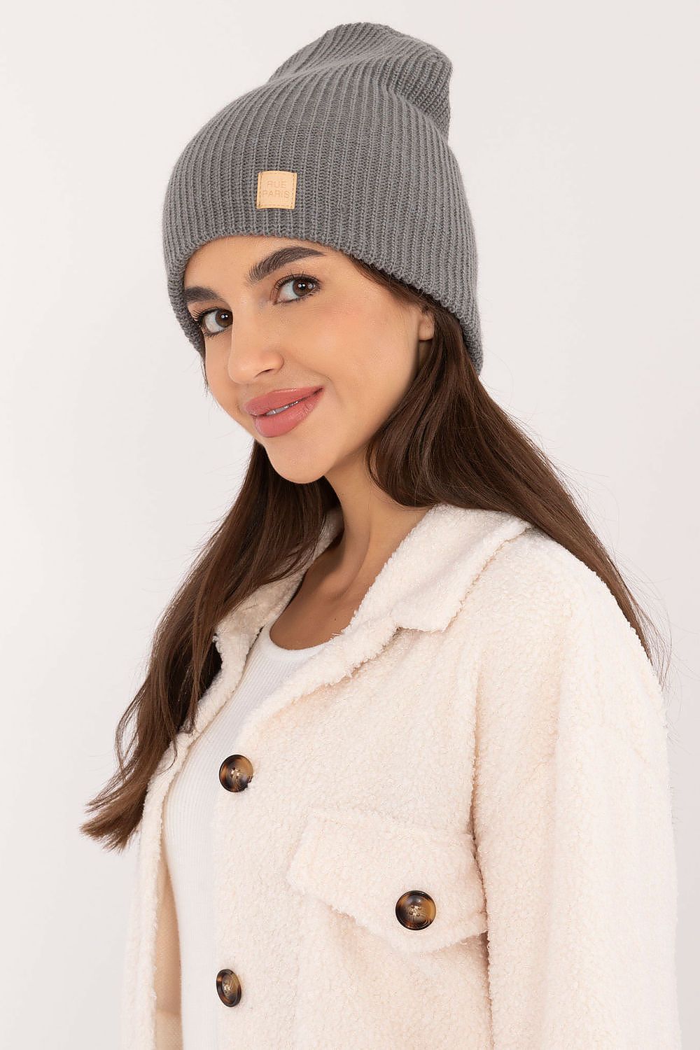 Beautifully crafted acrylic beanie by Rue Paris, epitomising classic style with a contemporary twist.