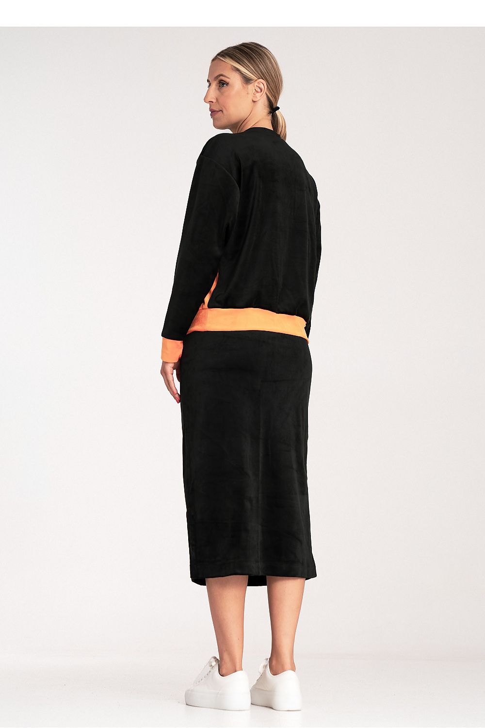 Fashionable ladies' outfit by Figl, displaying the complete look of a two-colour blouse and chic pencil skirt.