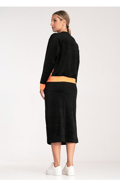 Fashionable ladies' outfit by Figl, displaying the complete look of a two-colour blouse and chic pencil skirt.