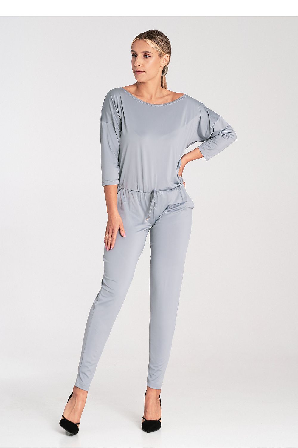 Elegant luxury Figl loose-fitting jumpsuit with tapered legs, tied waist, and sophisticated boat neckline, showcasing timeless styling for modern elegance.