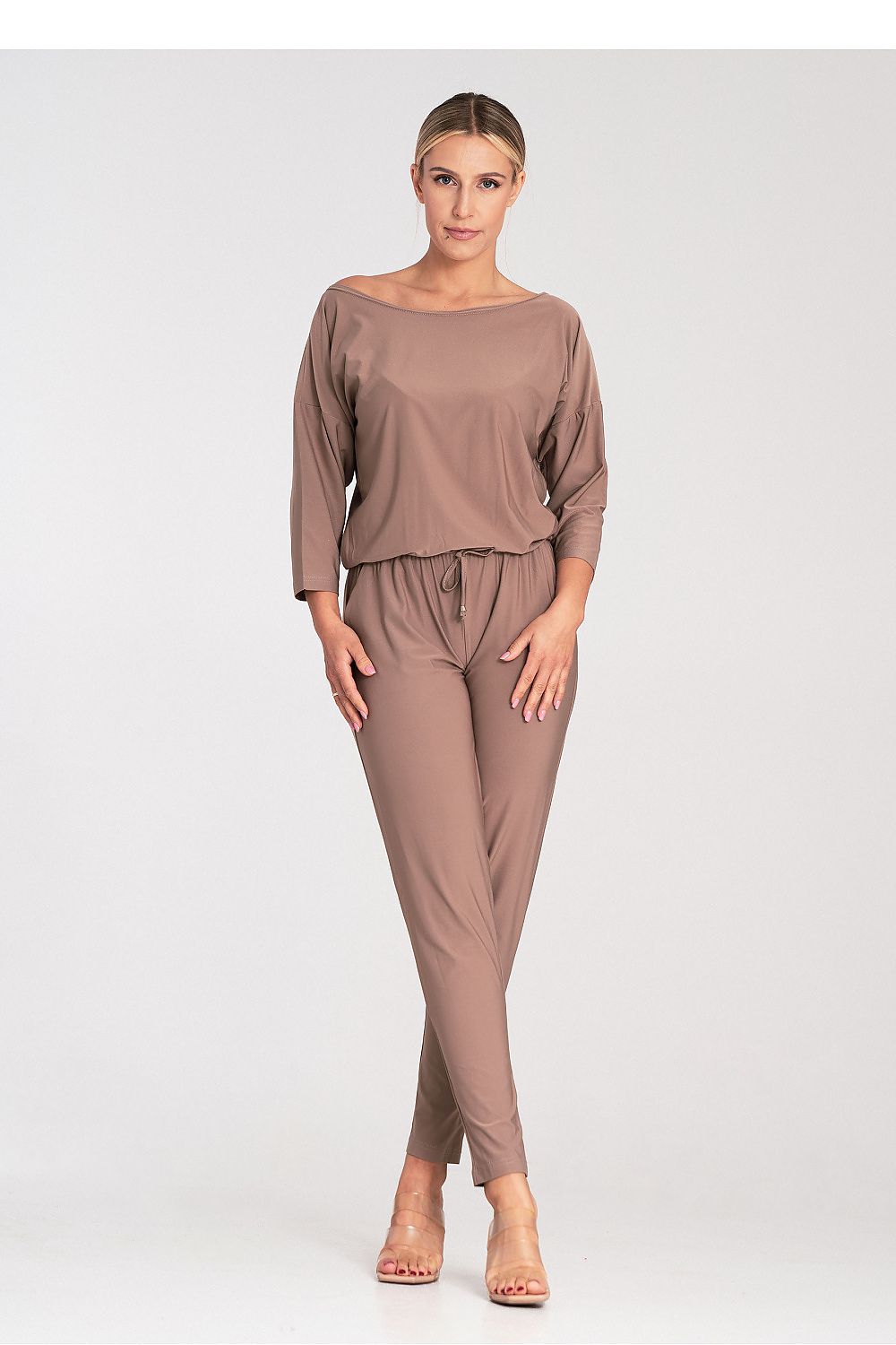 Close-up of the premium fabric of the Figl luxury jumpsuit, showcasing the exquisite tailoring and elegant 3/4 sleeves.