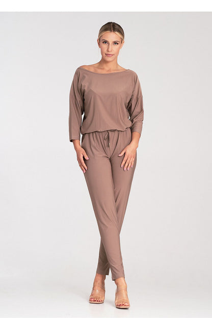 Close-up of the premium fabric of the Figl luxury jumpsuit, showcasing the exquisite tailoring and elegant 3/4 sleeves.