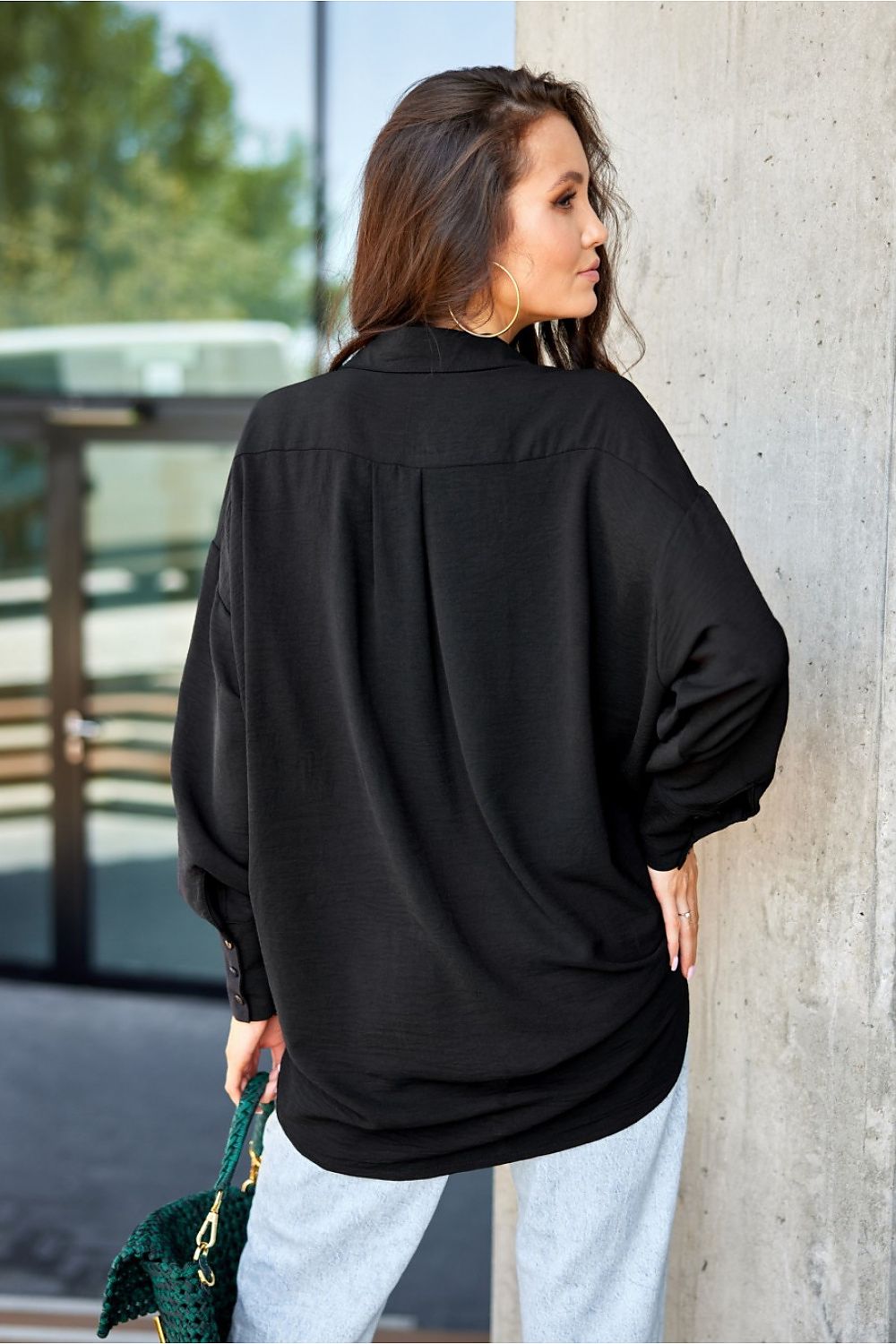 Detail view of the unique buff long sleeves and cute pocket on the women's shirt from Roco Fashion.