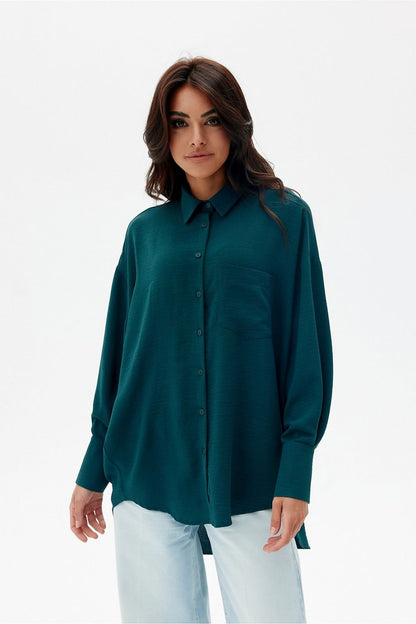 Luxurious asymmetrical oversized women's shirt with long sleeves and classic collar from Roco Fashion, showcasing its stylish design and elegant appeal.