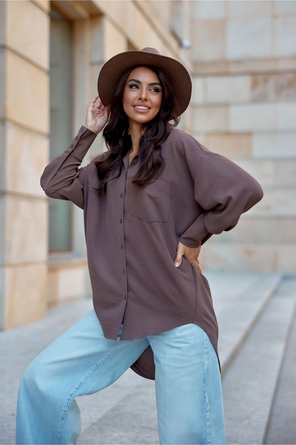 Stylish presentation of Roco Fashion's women's oversized shirt with a longer back and classic collar, epitomising comfort and sophistication in modern fashion.