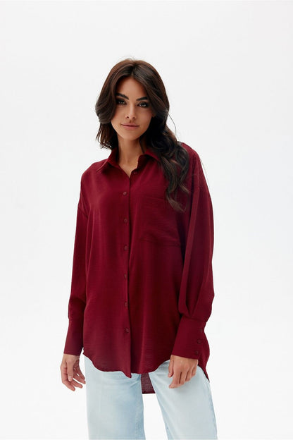 Asymmetrical oversized long sleeve women's shirt in elegant style from Roco Fashion, featuring a classic collar and unique front pocket.