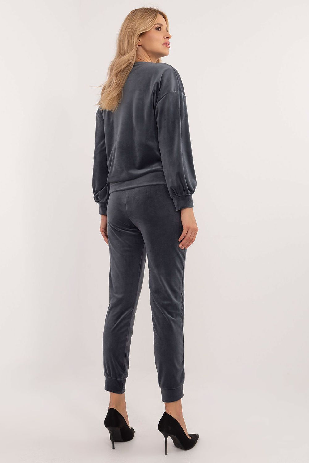 Model showcasing Italy Moda's Luxury Women's Velour Lounge Set with high-rise pants and ribbed cuffs, perfect for casual chic occasions.