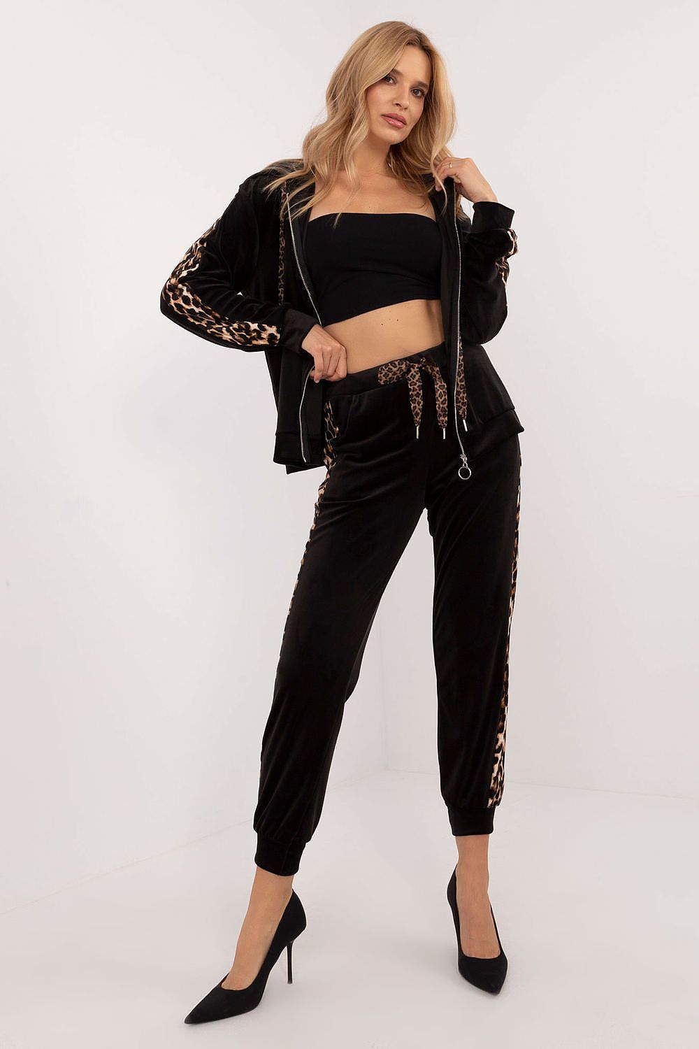 Luxurious women's velour set by Italy Moda featuring a stylish blouse with animal-pattern leopard stripes and comfortable high-waisted pants, perfect for casual elegance.