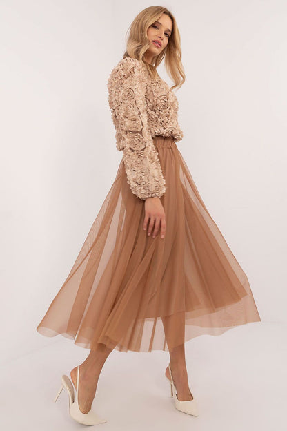 Model wearing the Italy Moda elegant midi flared tulle skirt at a chic outdoor event, illustrating its versatility for various occasions.