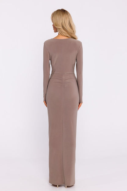 Back view of the Moe elegant long dress showcasing long sleeves, modeling pleats, and high slit, perfect for a sophisticated silhouette.