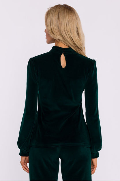 Luxurious Moe blouse showcasing a sensual halter neckline and elegant wide sleeves, designed for chic occasions.