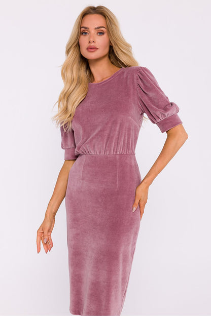 Side view of Moe's elegant velour knit dress featuring a classy pencil bottom and refined cuffed sleeves, perfect for special occasions.
