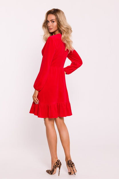 Elegant velour knit daydress by Moe featuring a deep V-neck and flared ruffle hem, perfect for luxurious occasions.
