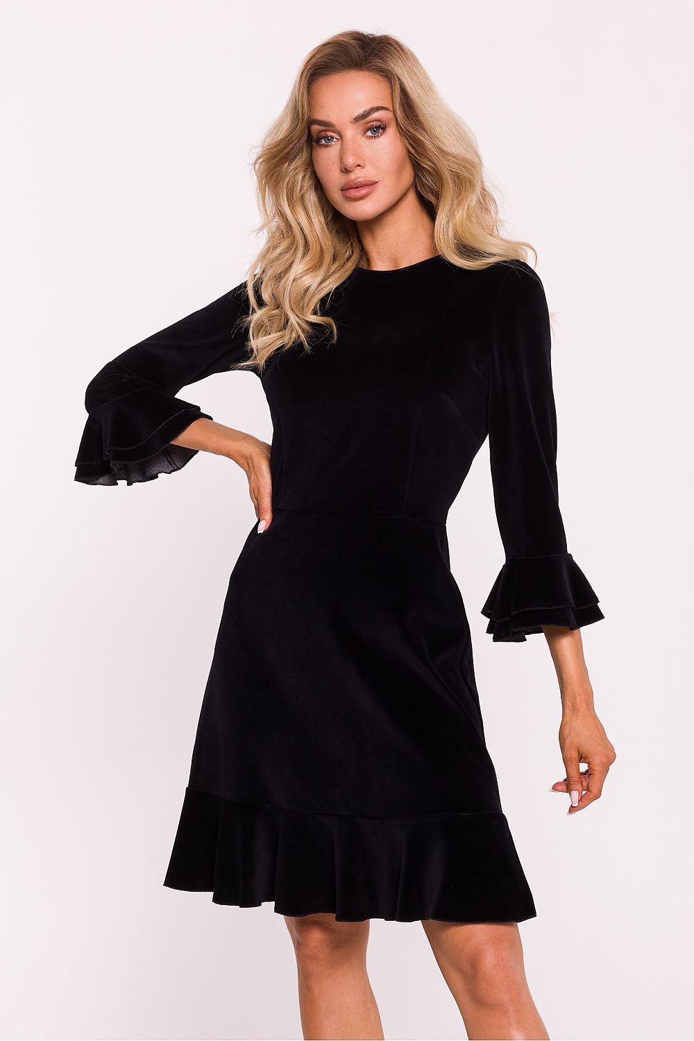 Elegant velour knit daydress by Moe, featuring ruffled sleeves and a classic neckline, ideal for luxurious everyday wear.