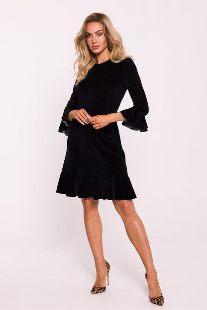Charming below-the-knee velour dress designed by Moe, showcasing delicate ruffles and a flattering silhouette for sophisticated occasions.