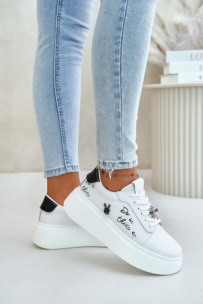 Step in style luxury women's sneakers in natural leather, designed with a decorative pin and crafted for comfort, suitable for EU sizes 36-40.