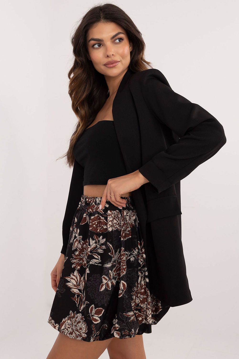 Italy Moda Floral Print Mini Skirt in EU Size 0, showcasing a lightweight polyester fabric with delicate floral patterns, designed for elegance and comfort.