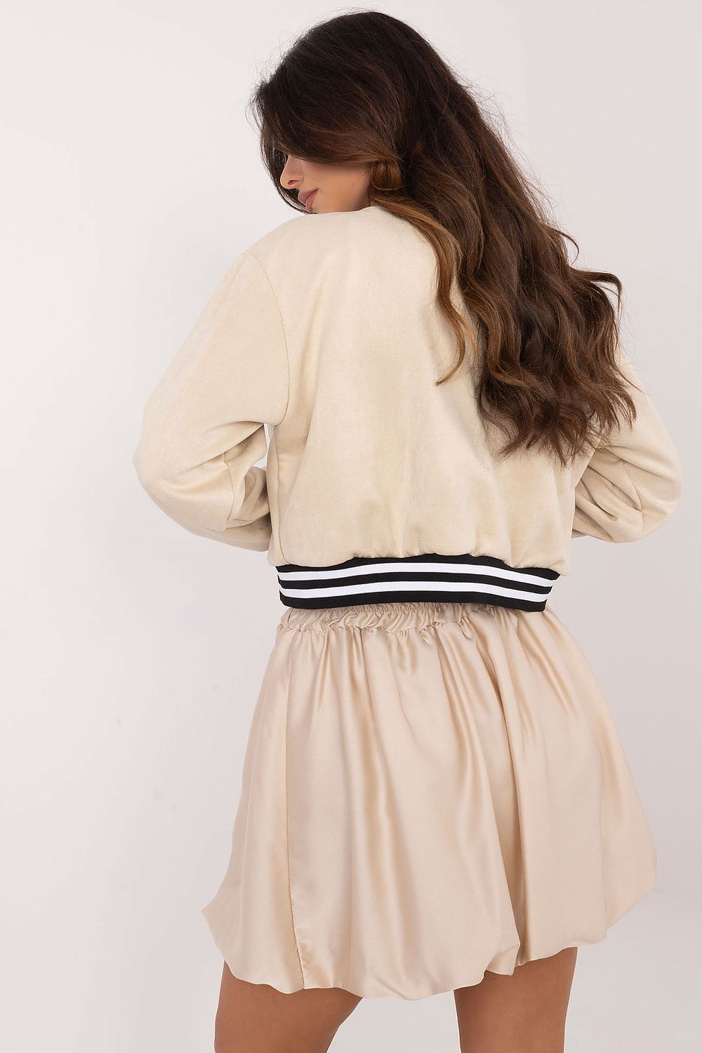 Chic Italy Moda mini skirt in elegant polyester with elastic waistband, showcasing a stylish bomber cut and subtle sheen, ideal for luxurious casual styling.