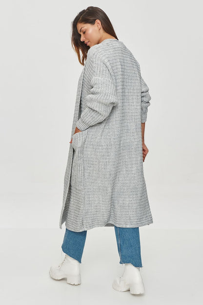 Close-up of Makadamia women's long cardigan showcasing the ribbed weave texture, designed for comfort and style in cool weather.