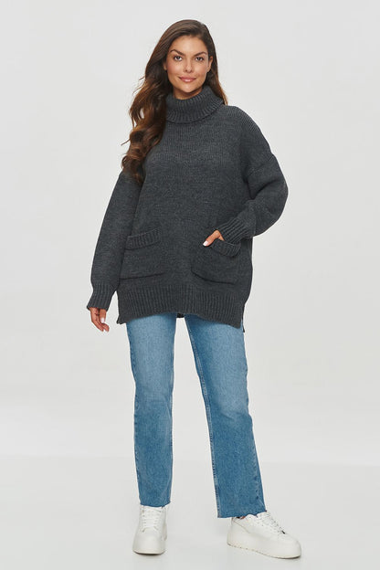 Elegant Makadamia women's sweater showcasing reglan sleeves and two functional patch pockets, designed for both comfort and style during colder days.