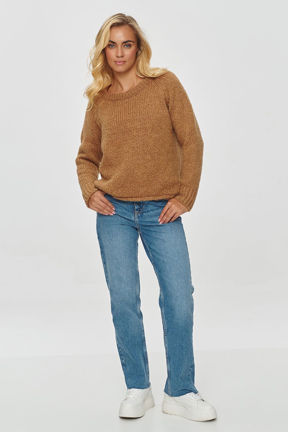 Elegant Makadamia sweater in soft fabric, showcasing a relaxed fit perfect for casual ensembles.